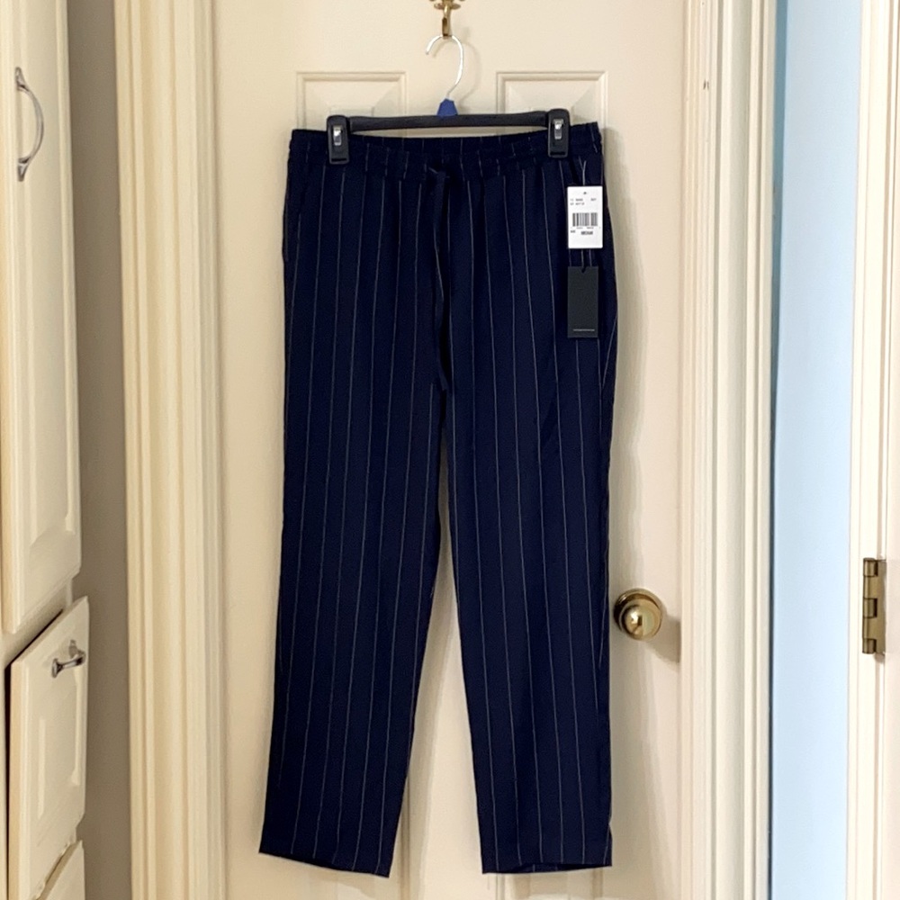 Navy pants with stripes on the front and back